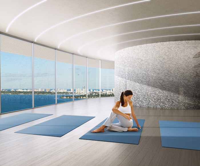 Calming yoga in the clouds inside the Aria on the Bay